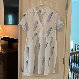 White dress with blue feather design. Silky and comfy. Never been worn.